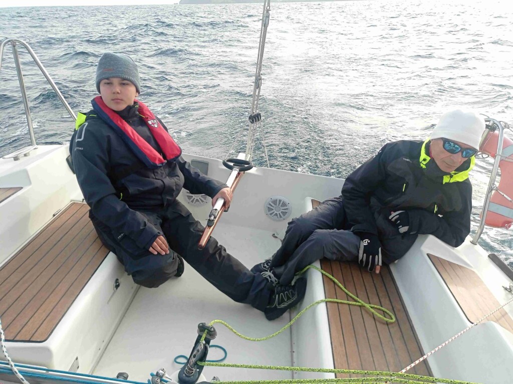 Pierluigi Russo (12) at the helm of his grandfather Luigi Russo's (73) First 31.7, the owner of Bagheera
